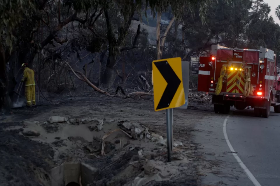 Fire engine parked by burned area during Woolsey Fire